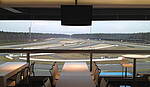 VIP-Lounge Mercedestribüne mit Blick zur Spitzkehre
